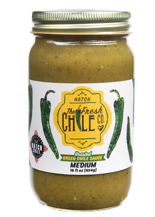 A jar of Roasted Hatch Green Chile Sauce in medium heat, gluten free, 16 oz, isolated on a white background.