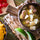 Bowl of Hatch green chile stew with pork and potatoes, with lime wedges