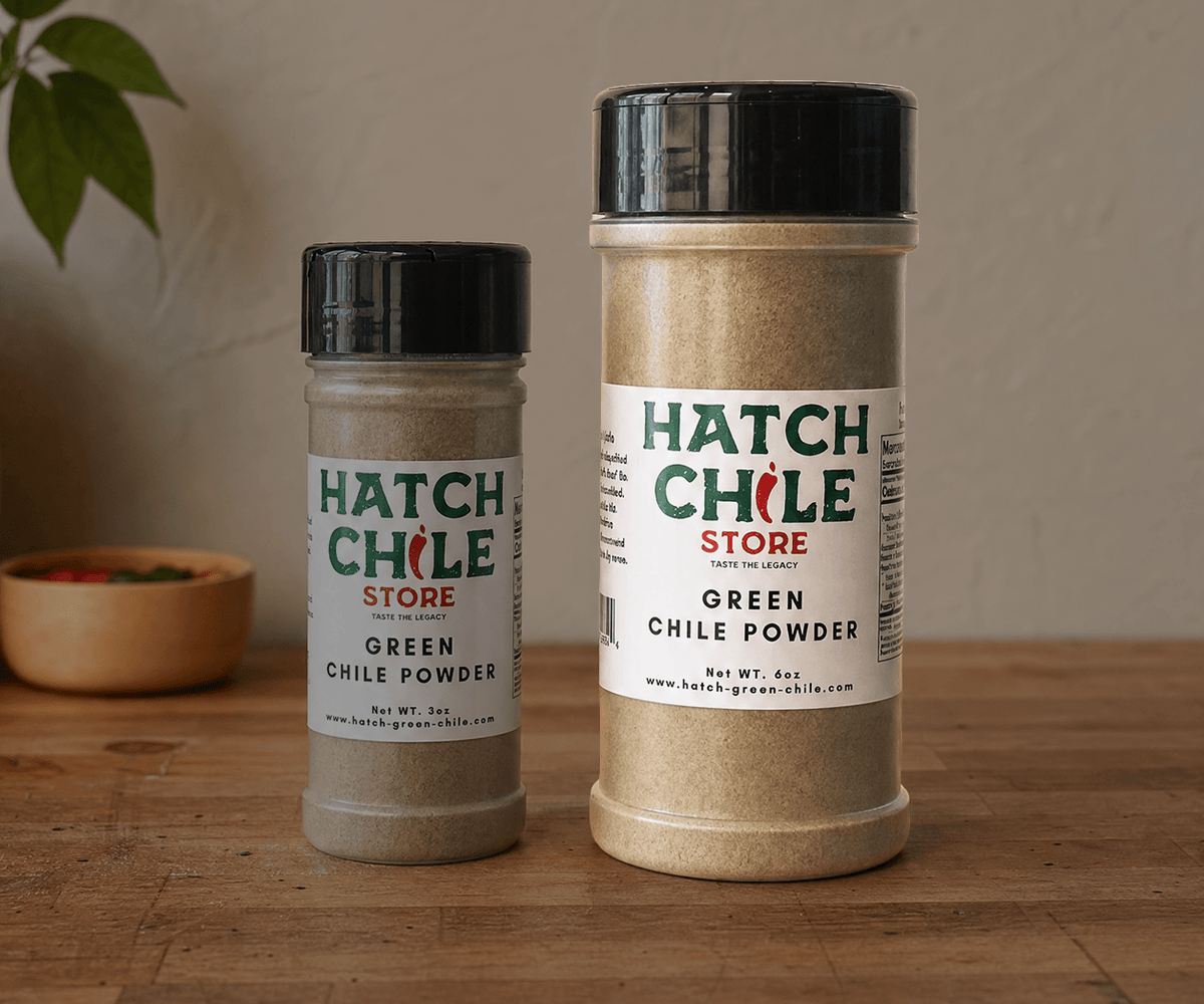 Hatch green chile powder shaker jars in 3 oz and 6 oz sizes on wood