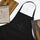 Chile Zia Embroidered Apron — embroidered apron in black, close-up