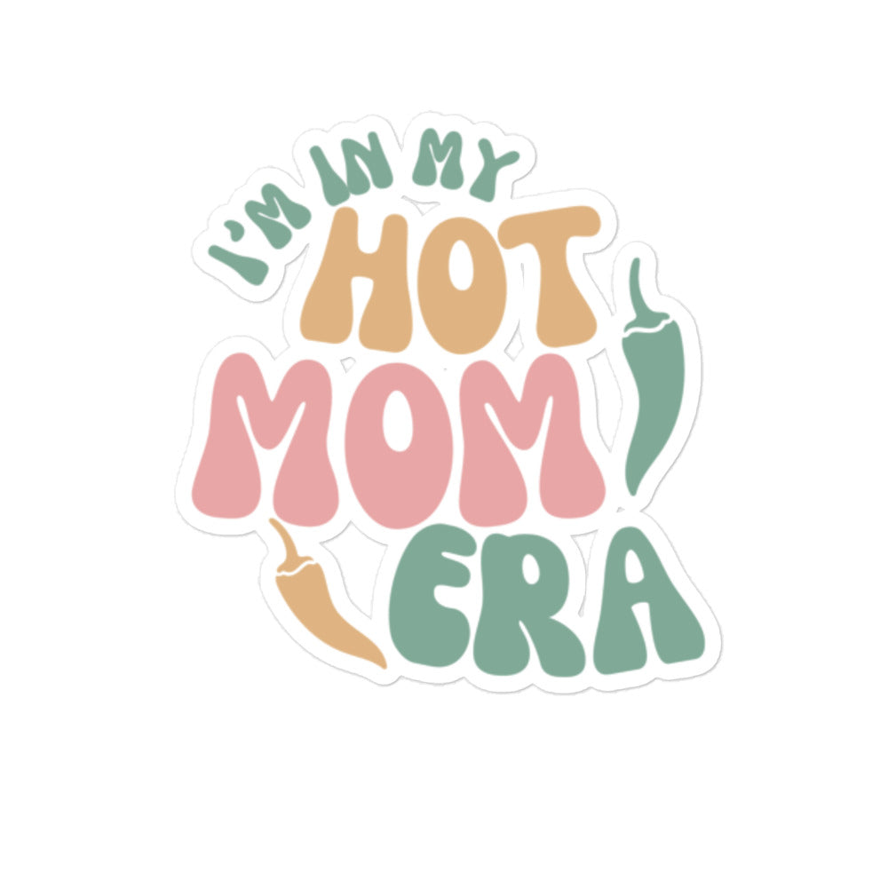 A pastel-colored Era Sticker with the phrase "i'm in my hot mom era" written in playful, bubble letters, accompanied by a small illustration of a chili pepper, perfect for decorating laptops.