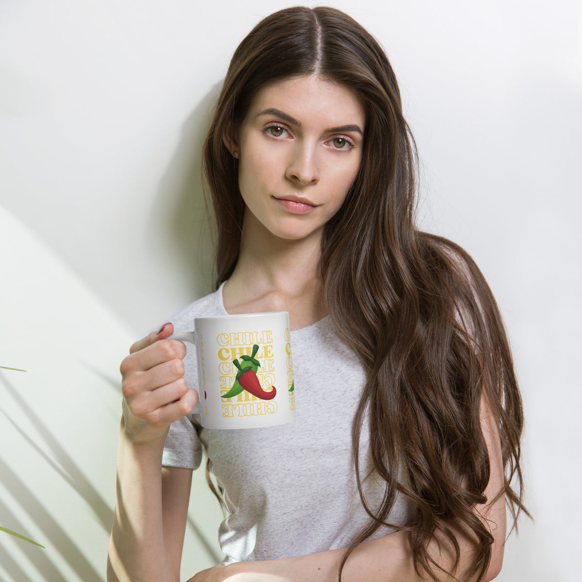 Red & Green Mug — glossy ceramic mug, 20 oz in white, held by a model