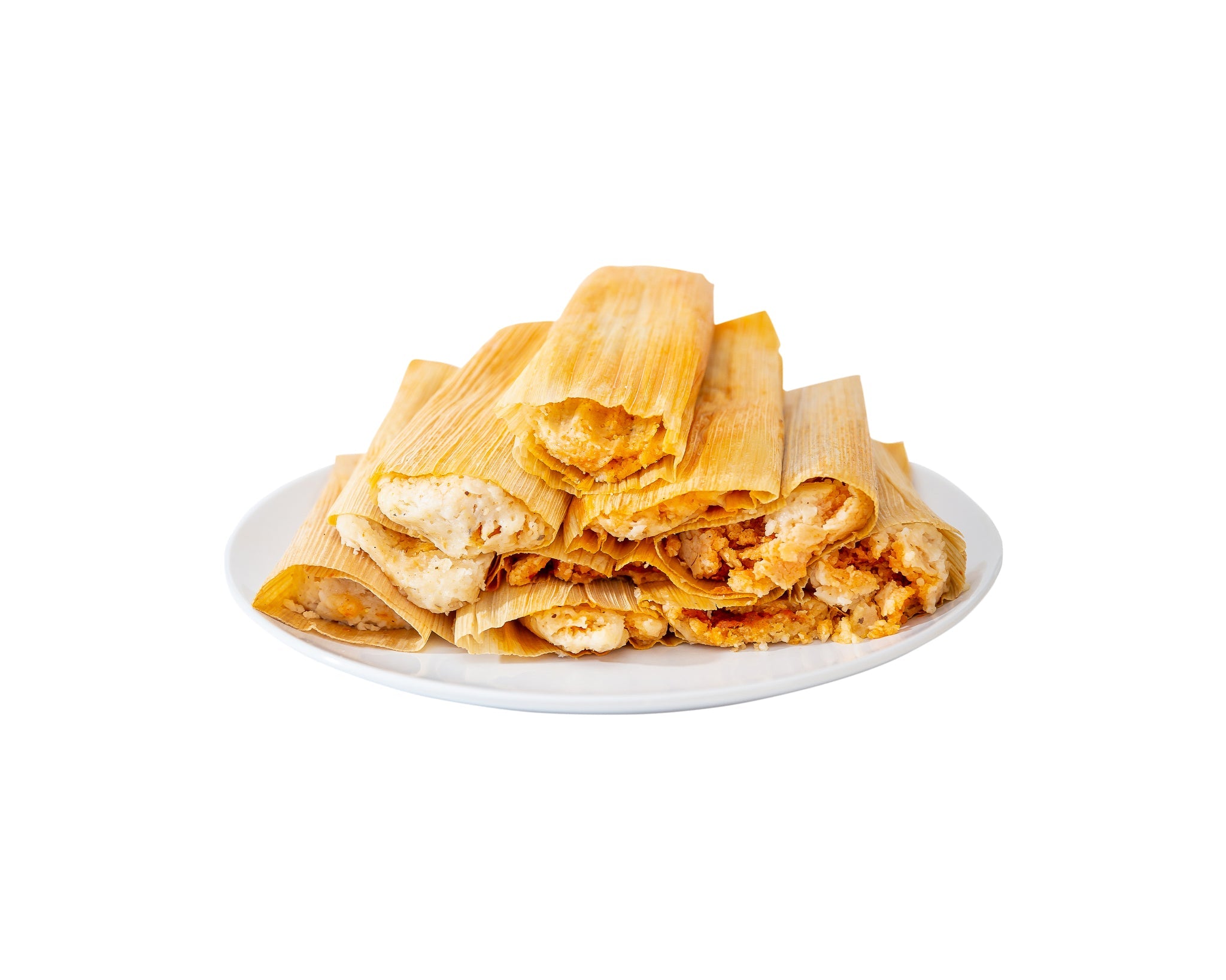 A plate of Tamale Trio Sampler tamales, wrapped in corn husks, filled with seasoned meat, isolated on a white background.