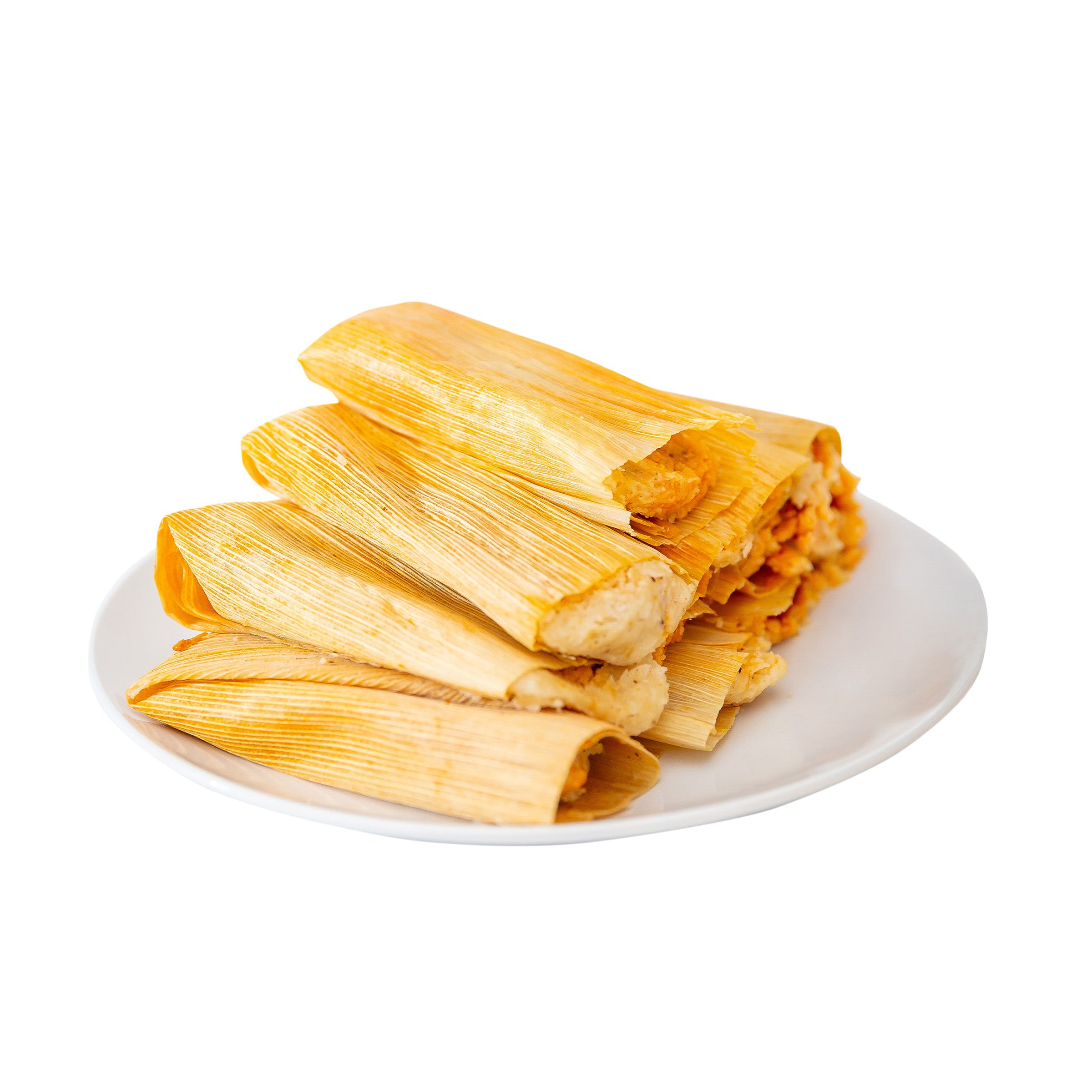 A plate of freshly made Hatch Green Chile Veggie Tamales with golden corn husks, containing visible fillings, isolated on a white background.