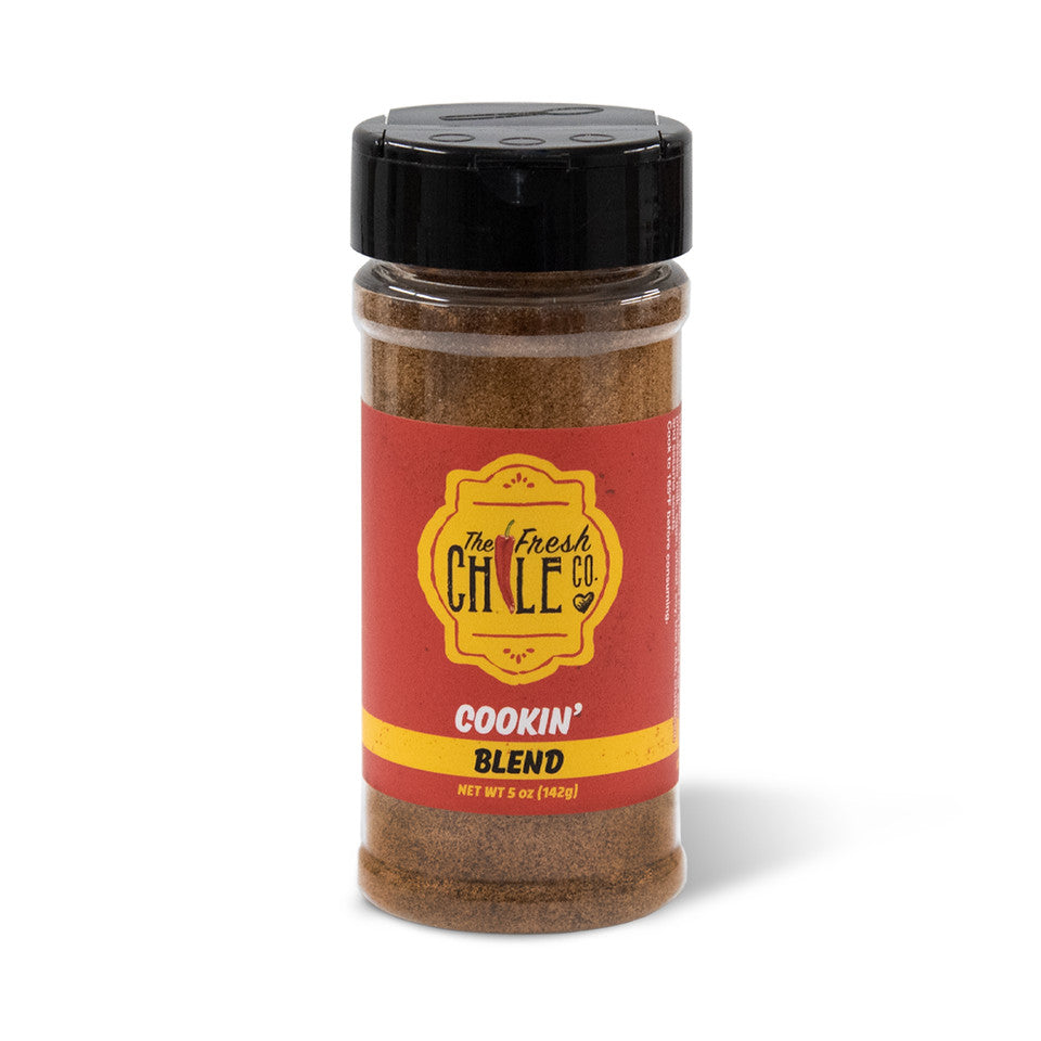 A spice jar labeled "Country Bob's Seasoning," containing a reddish-brown seasoning, isolated on a white background.