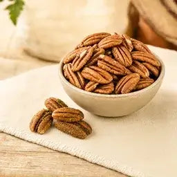 New Mexico pecan halves in a bowl with green chile pecans
