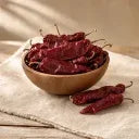 Dried Hatch red chile pods in a wooden bowl