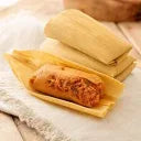 Hatch red chile pork tamales in corn husks