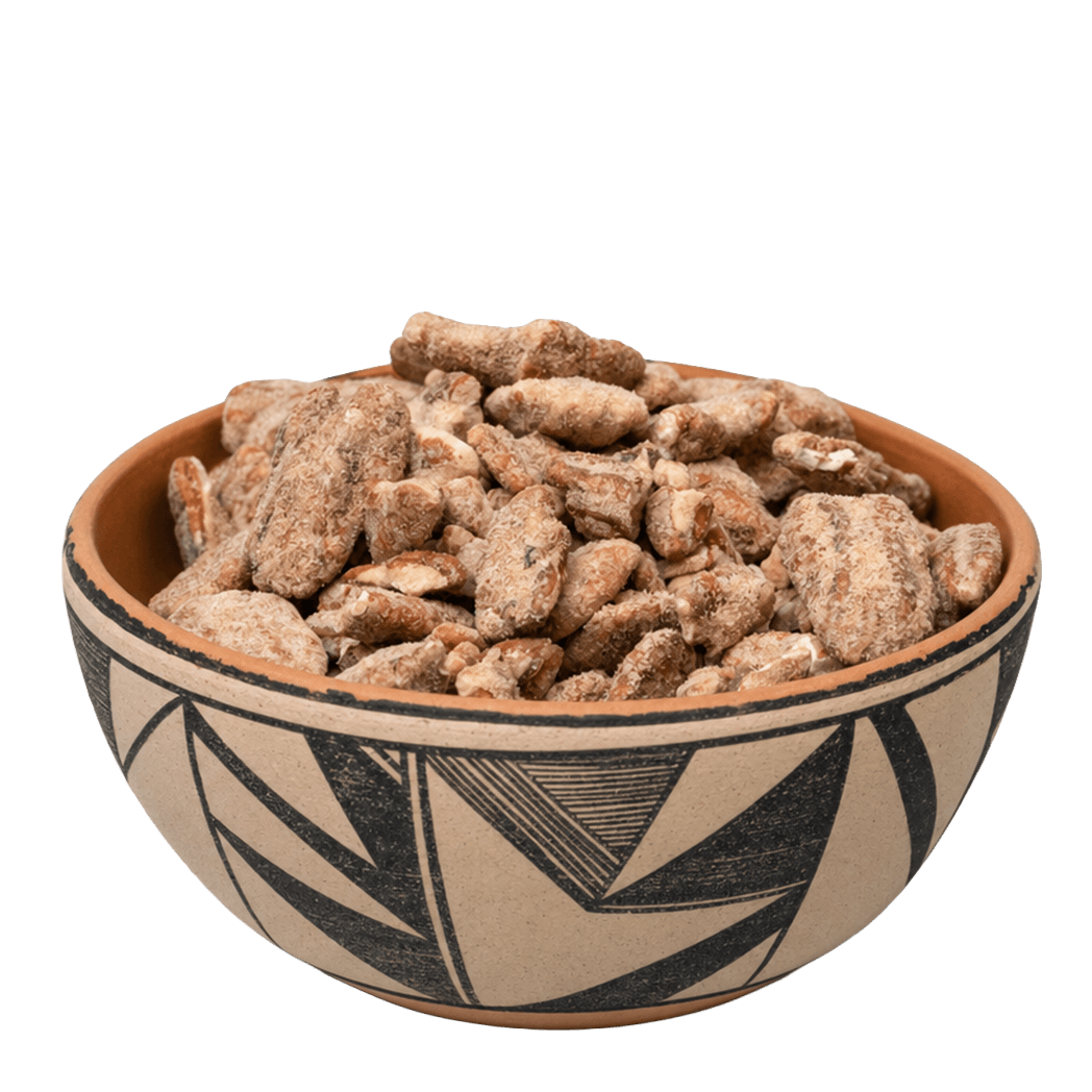 Sweet and hot seasoned pecans in a black-and-white New Mexico pottery bowl
