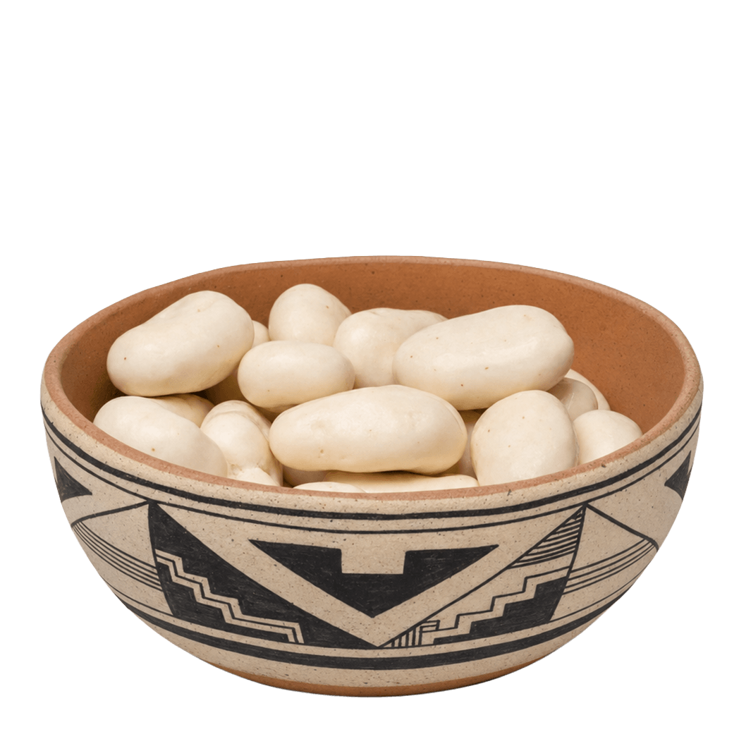 Yogurt-covered pecans in a Southwestern black-and-tan pottery bowl