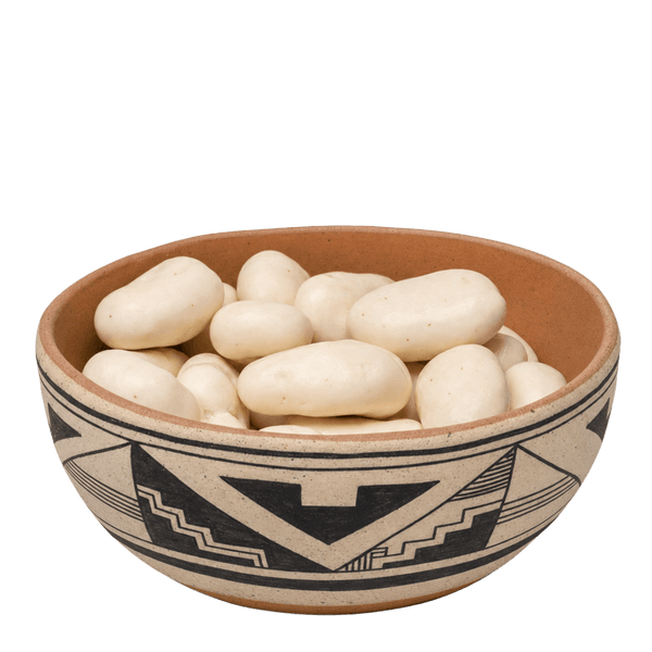 Yogurt-covered pecans in a Southwestern black-and-tan pottery bowl