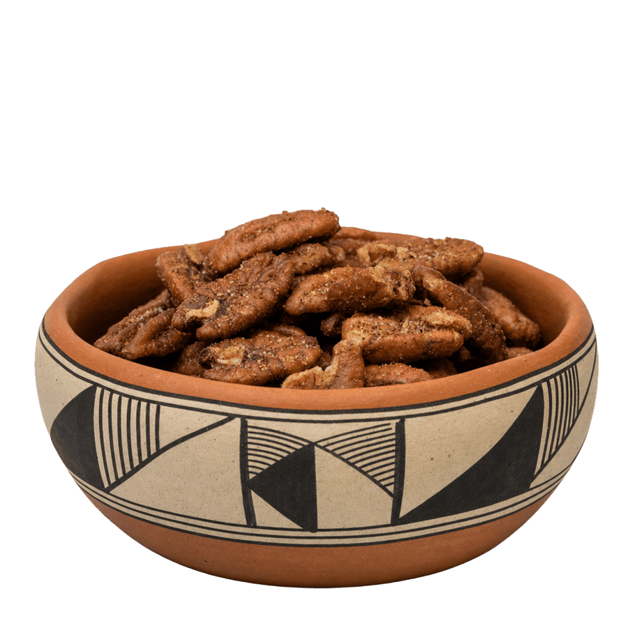 Green chile pecans in a black-on-tan Pueblo pottery bowl