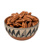 Pecan halves in a Southwestern pottery bowl with black geometric pattern