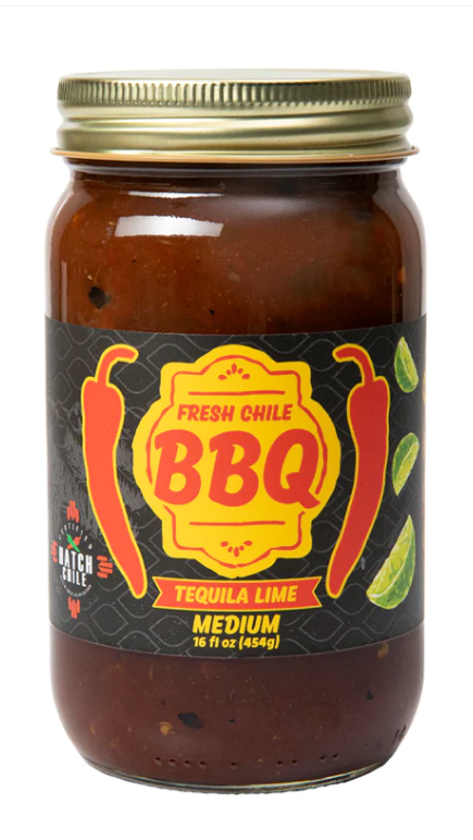 A glass jar of fresh Hatch Tequila Lime BBQ sauce, labeled "Hatch Tequila Lime" in medium heat, 16 oz, with a black label featuring red chili graphics and text.