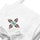 Chile Zia Embroidered Apron — embroidered apron in white, close-up
