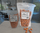 Red chile pistachios in 8 oz and 16 oz resealable bags with loose nuts nearby