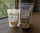 Green chile pistachios in 8 oz and 16 oz resealable bags on a wooden table
