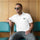 Model wearing the white Hatch Chile Store premium polo
