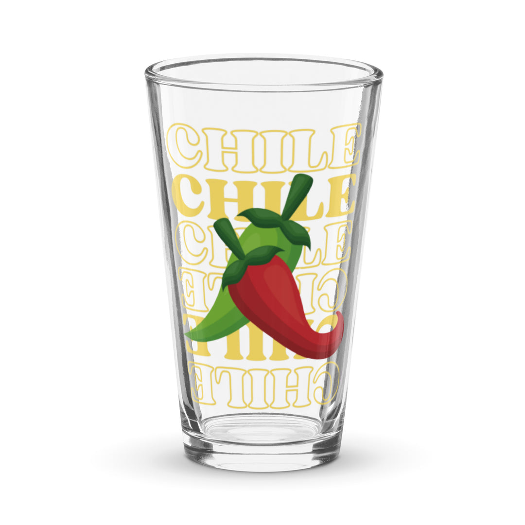 A Red & Green Chile Glass from our glassware collection printed with the word "chile" in bold, yellow letters, accented by an illustration of a green and red chili pepper, against a white background.