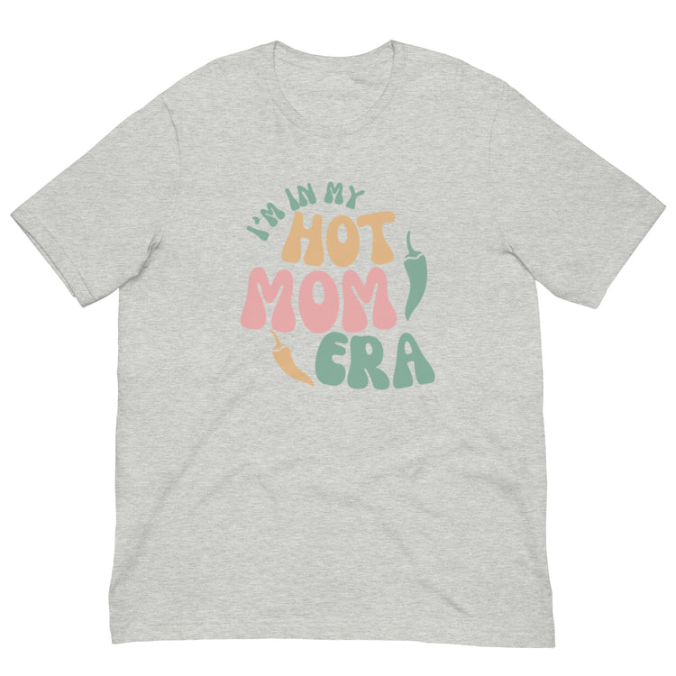 A light gray breathable Era Shirt with the phrase "i'm in my hot mom era" printed in colorful, playful letters across the front.