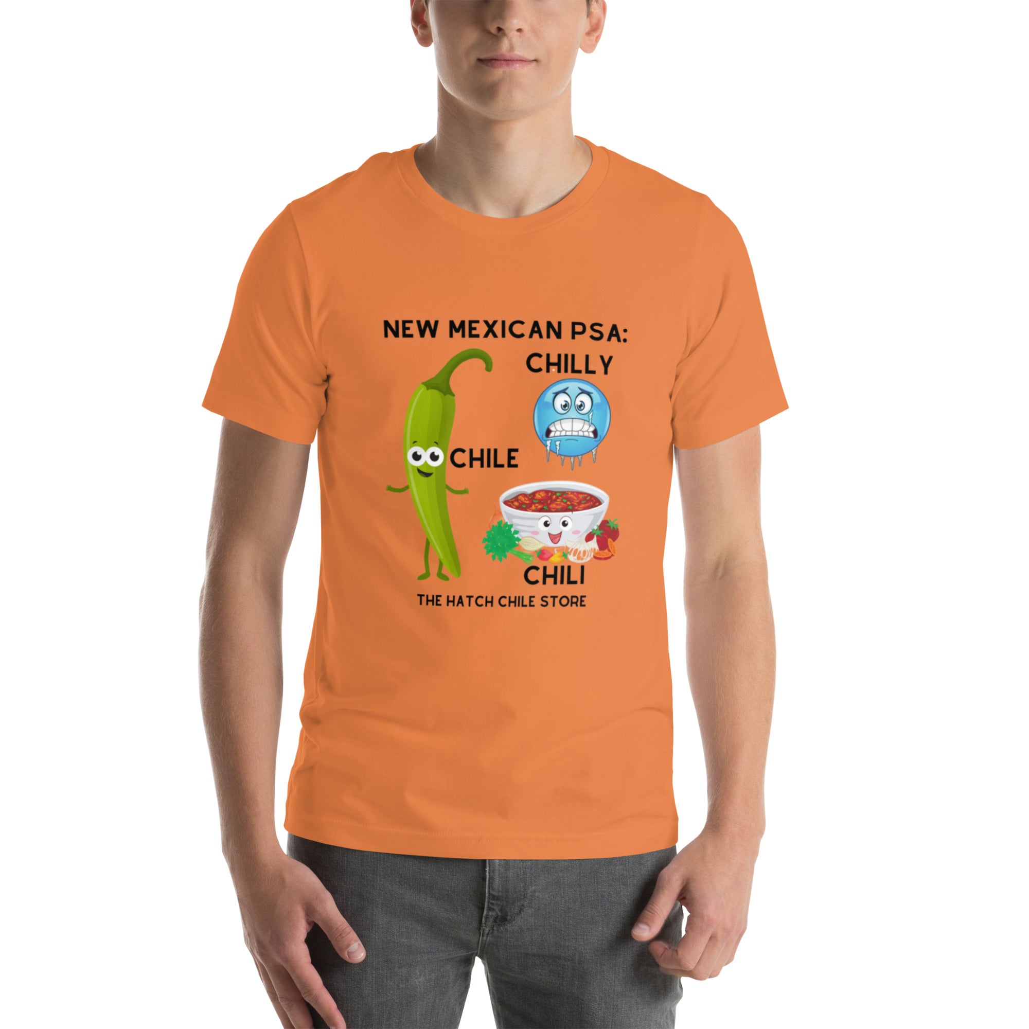 A man wearing a PSA Shirt featuring a humorous print with green chile, blue chili, and a red bowl of chili with the text "New Mexican PSA: Ch