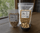 Green chile pistachios in 8 oz and 16 oz resealable bags with a bowl of nuts