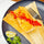 Green chile chicken tamale topped with red chile sauce, with lime and cilantro