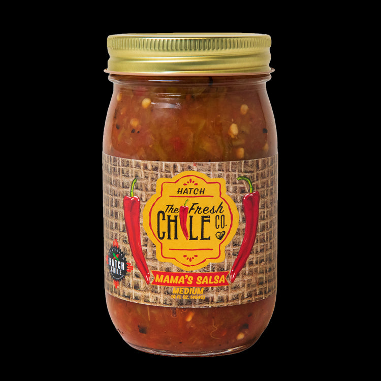 A jar of "Mama's Blended Hatch Chile Salsa" medium, showcasing a label with vibrant colors and illustrations of chiles, against a clear jar filled with chunky salsa.