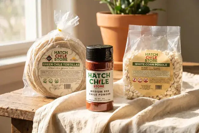 Hatch red chile powder jar with green chile corn tortillas and posole