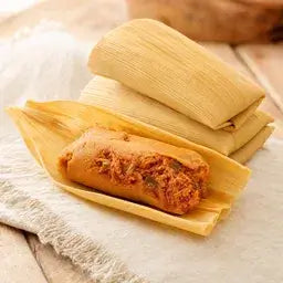 Hatch red chile pork tamales in corn husks